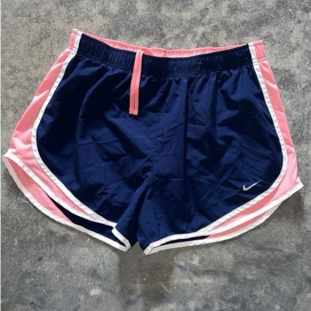Nike Navy Blue Athletic Shorts with Pink Accents and Curved Hem
